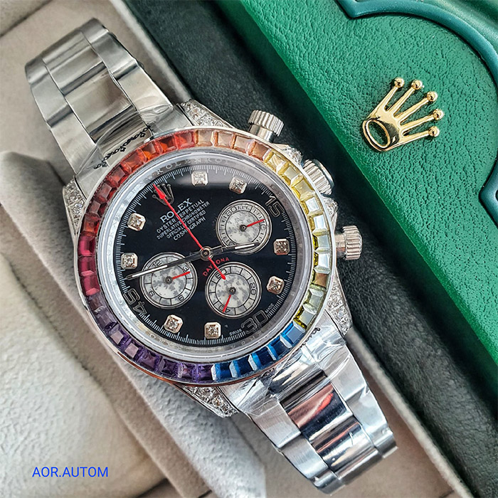 Reloj Rolex Oyster Perpetual Daytona con bisel multicolor, esfera negra y cronógrafo, ideal para quienes buscan un reloj elegante, deportivo y de lujo.